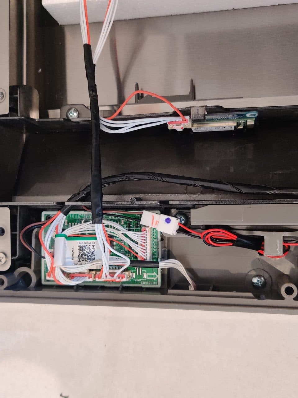 Dishwasher door control board: Samsung dishwasher, model DW80R9950US (dishwasher repair in Boca Raton, FL, September 2026)