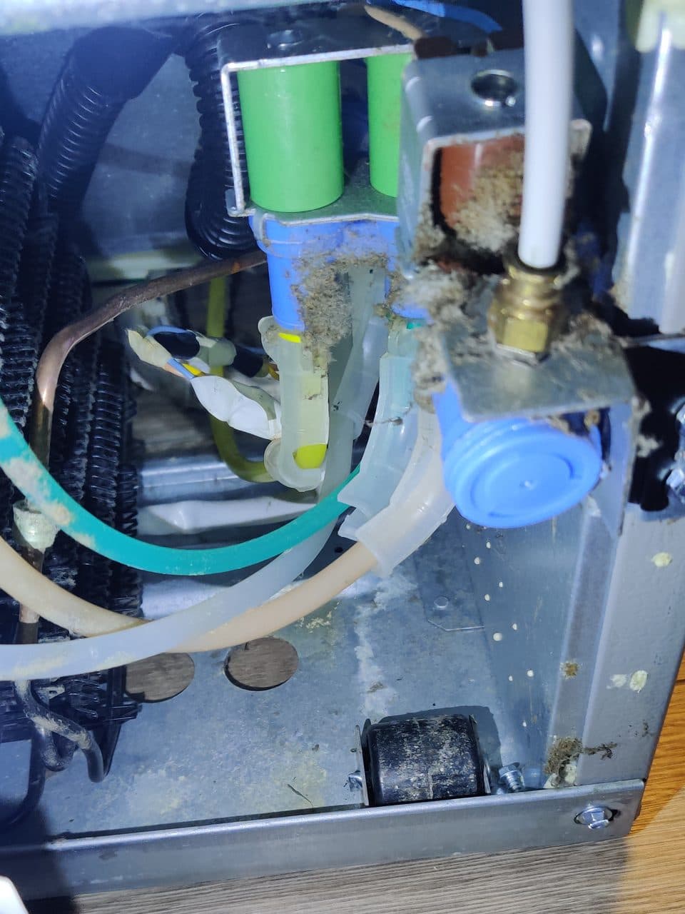 Leaking water inlet valve behind the refrigerator: Frigidaire refrigerator, model FRSC2333AS0 (refrigerator repair in Greenacres, FL, July 2026)