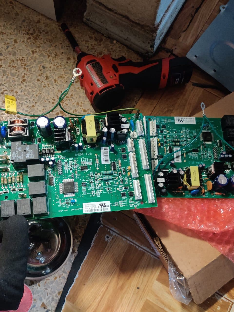 Old and new refrigerator control boards: GE refrigerator, model GNE25JSKBFSS (refrigerator repair in North Miami, FL, August 2026)