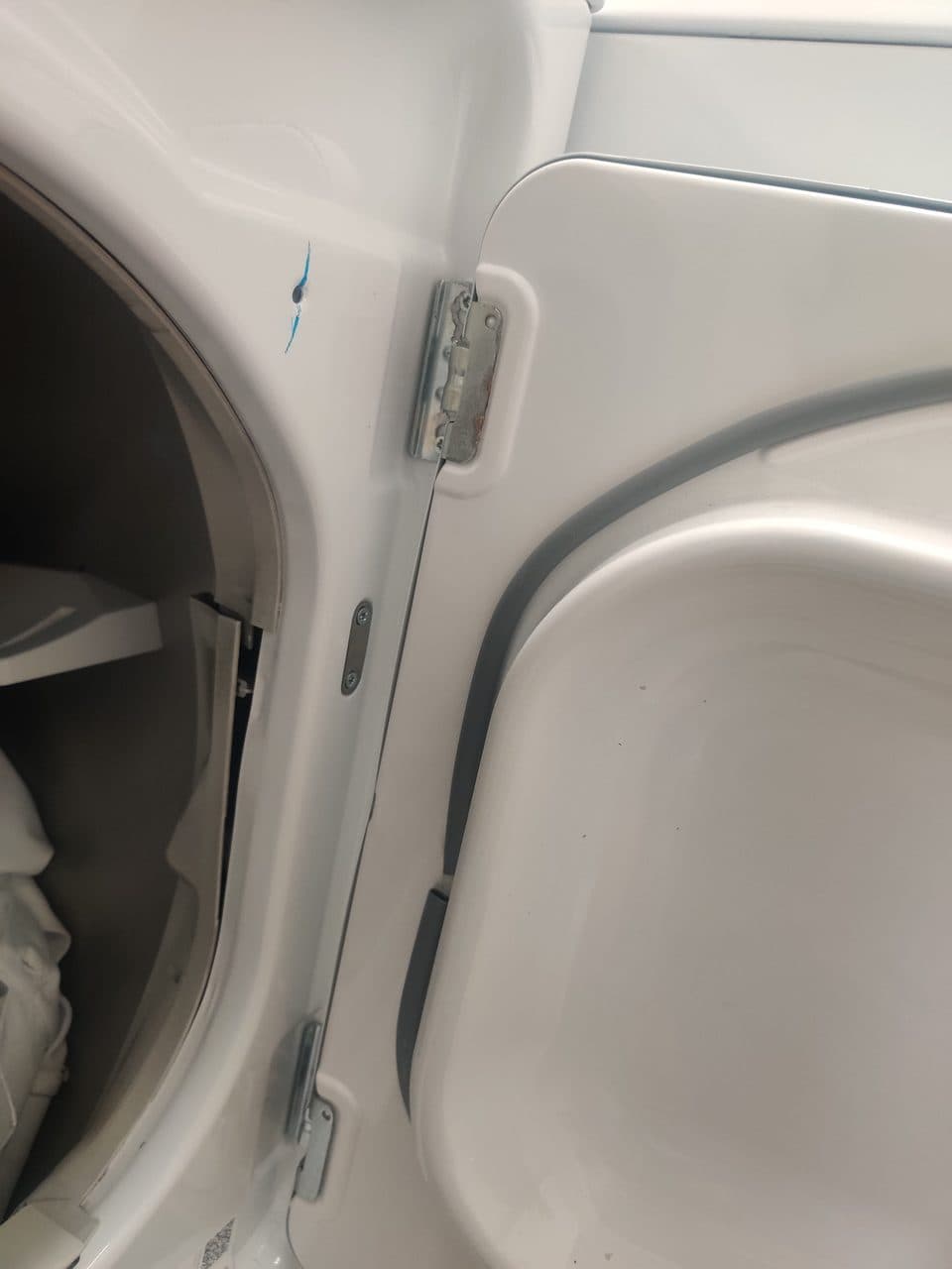 Checking the dryer door hinge: GE dryer, model GTD45EASJ2WS (dryer repair in Palm Beach Gardens, FL, October 2026)