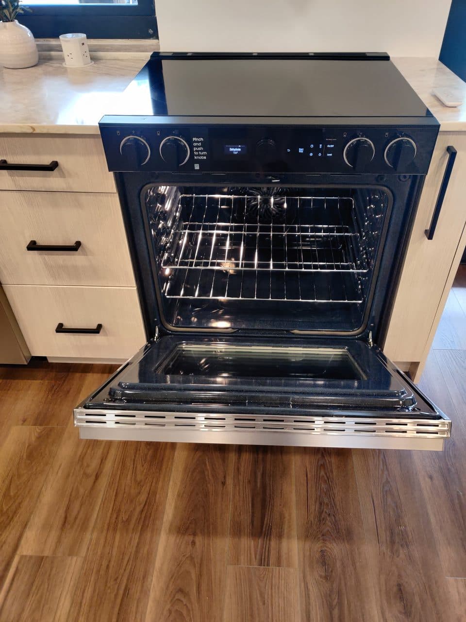 Slide-in electric range with the oven door open